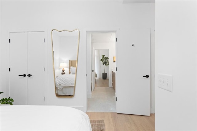 567 Ponce De Leon Ave NE Unit 614, Atlanta, GA 30308 - bedroom with light wood-style flooring and a closet
