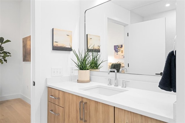 567 Ponce De Leon Ave NE Unit 614, Atlanta, GA 30308 - bathroom featuring vanity, wood finished floors, and baseboards