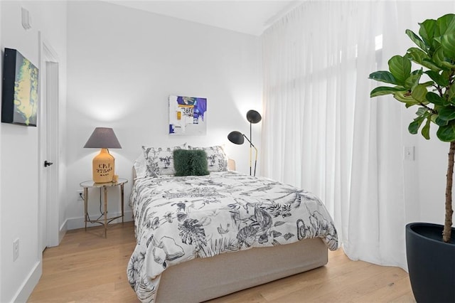 567 Ponce De Leon Ave NE Unit 614, Atlanta, GA 30308 - bedroom featuring wood finished floors and baseboards