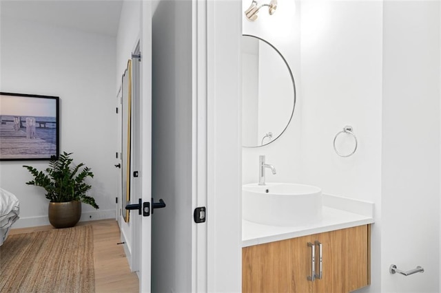 567 Ponce De Leon Ave NE Unit 614, Atlanta, GA 30308 - bathroom with vanity, wood finished floors, and baseboards