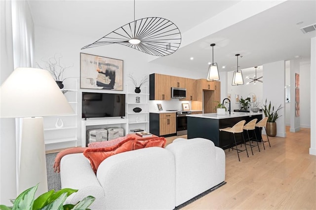 567 Ponce De Leon Ave NE Unit 614, Atlanta, GA 30308 - living area with light wood-type flooring, recessed lighting, and baseboards