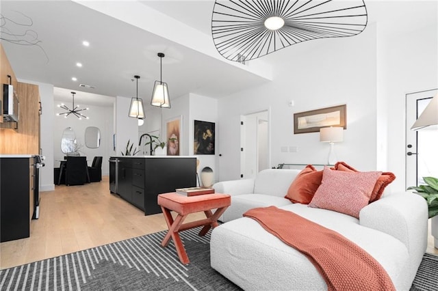 567 Ponce De Leon Ave NE Unit 614, Atlanta, GA 30308 - living room featuring light wood finished floors and recessed lighting