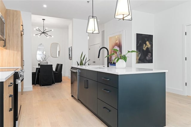 567 Ponce De Leon Ave NE Unit 614, Atlanta, GA 30308 - kitchen with electric range oven, dishwasher, light wood-style flooring, a center island with sink, and a chandelier