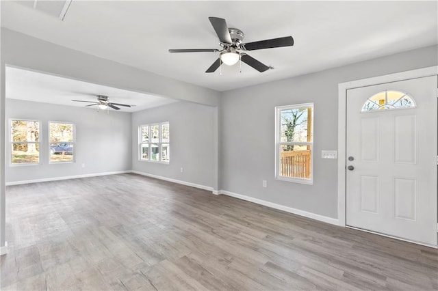 entryway with ceiling fan and light hardwood / wood-style floors