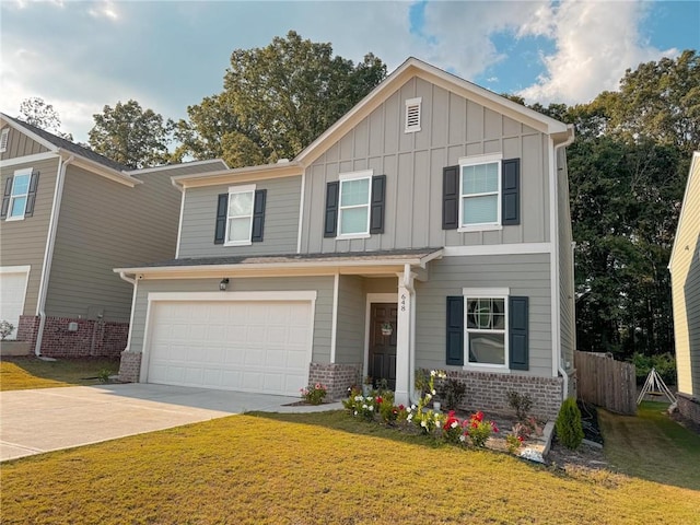 view of front of property with a front lawn and a garage