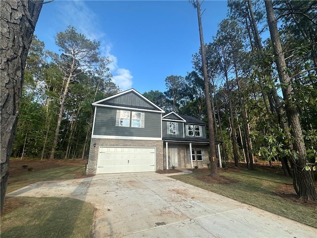 142 Tye St, Stockbridge, GA 30281 - view of front of home with brick siding, a garage, driveway, a front yard, and covered porch