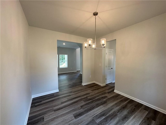 142 Tye St, Stockbridge, GA 30281 - unfurnished dining area with a chandelier and dark wood-type flooring