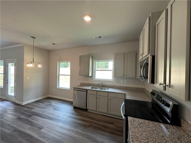 142 Tye St, Stockbridge, GA 30281 - kitchen with appliances with stainless steel finishes, dark wood-style floors, hanging light fixtures, gray cabinets, and light stone countertops