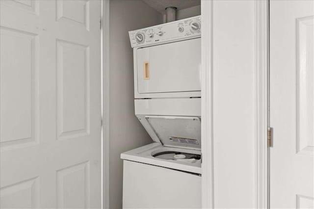 2736 Parkway Trl, Lithonia, GA 30058 - laundry room with stacked washing machine and dryer