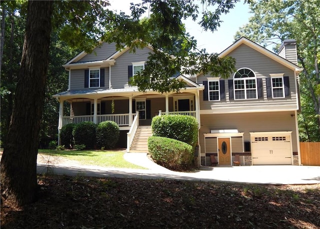 view of front of house featuring a garage and covered porch