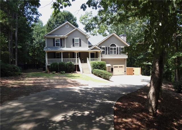 view of front facade with a porch and a garage