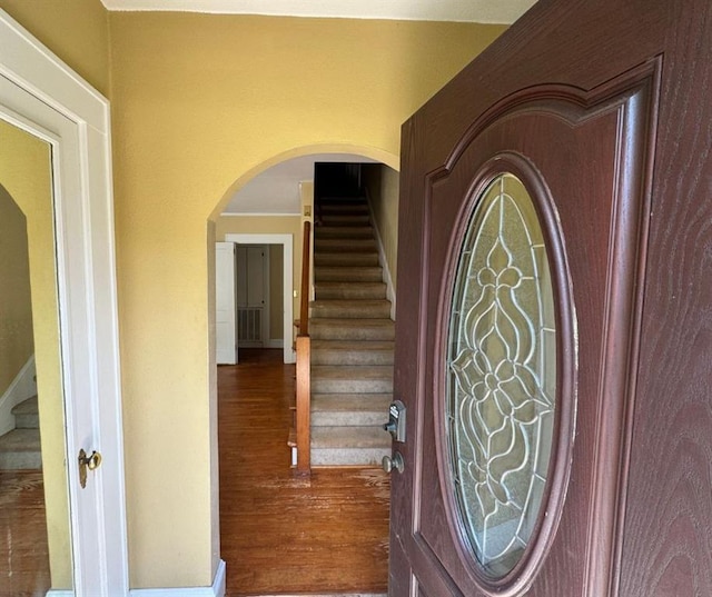 entryway with hardwood / wood-style flooring