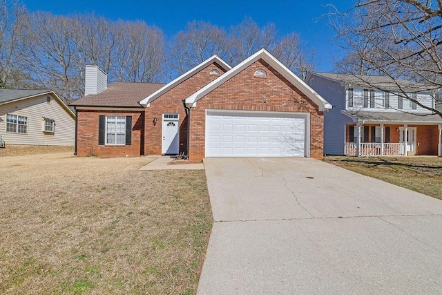 view of front of home featuring a garage and a front yard