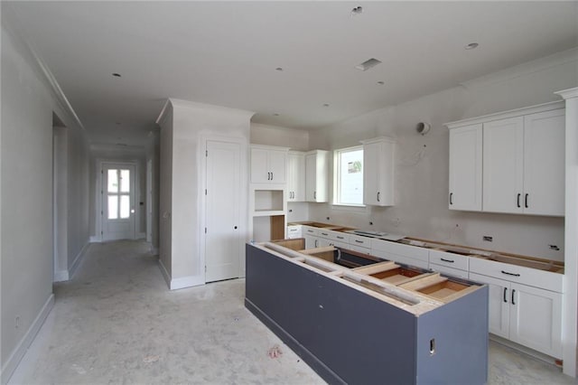 kitchen featuring white cabinetry and a kitchen island