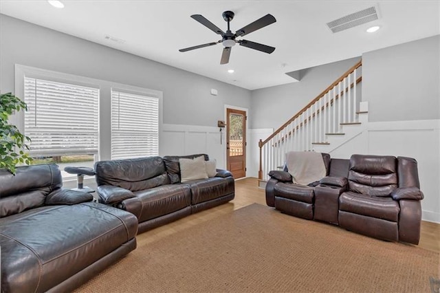 40 Crayton St, Rockmart, GA 30153 - living room featuring ceiling fan, stairs, wainscoting, a decorative wall, and recessed lighting