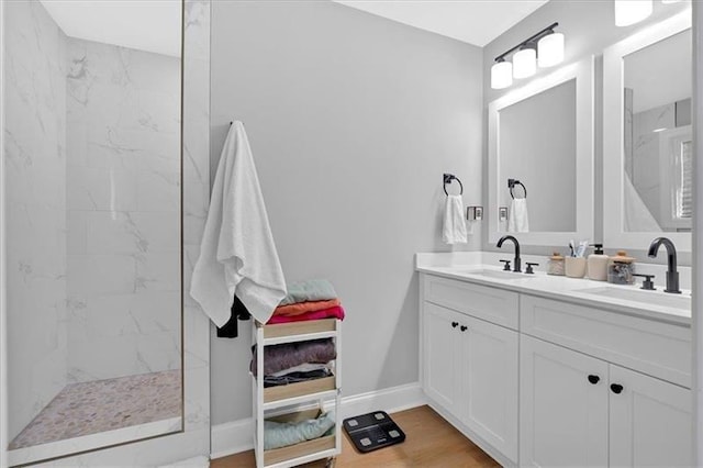 40 Crayton St, Rockmart, GA 30153 - full bathroom with double vanity, a marble finish shower, and wood finished floors