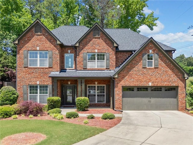 5285 Winflow Way, Suwanee, GA 30024 - view of front of property with roof with shingles, brick siding, concrete driveway, an attached garage, and a front lawn