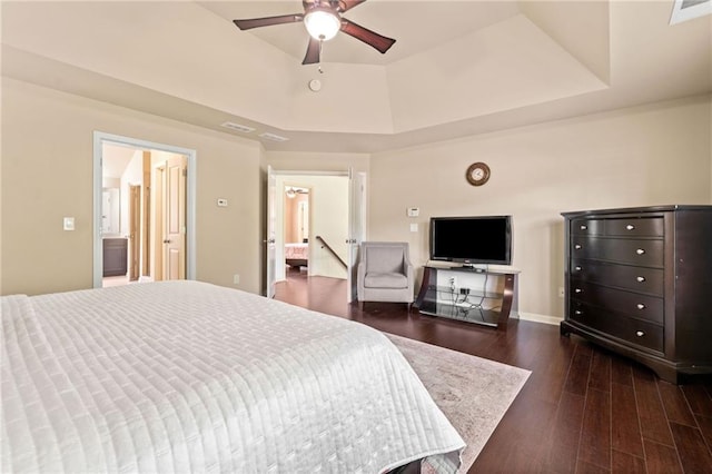 5285 Winflow Way, Suwanee, GA 30024 - bedroom featuring a raised ceiling, dark wood finished floors, and baseboards