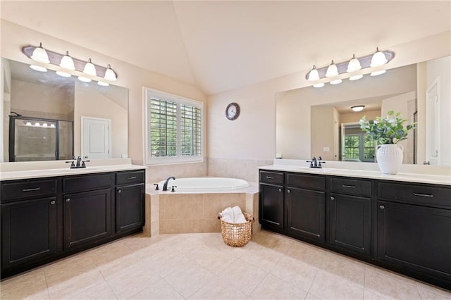 5285 Winflow Way, Suwanee, GA 30024 - bathroom featuring a stall shower, a bath, tile patterned floors, two vanities, and vaulted ceiling
