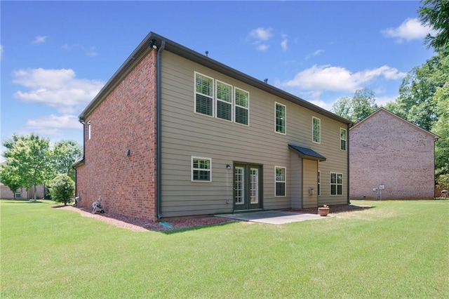 5285 Winflow Way, Suwanee, GA 30024 - back of property featuring a yard, brick siding, a patio, and french doors