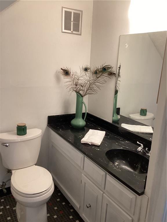 307 Adair St Unit 7-E, Decatur, GA 30030 - half bathroom with toilet, tile patterned floors, and vanity