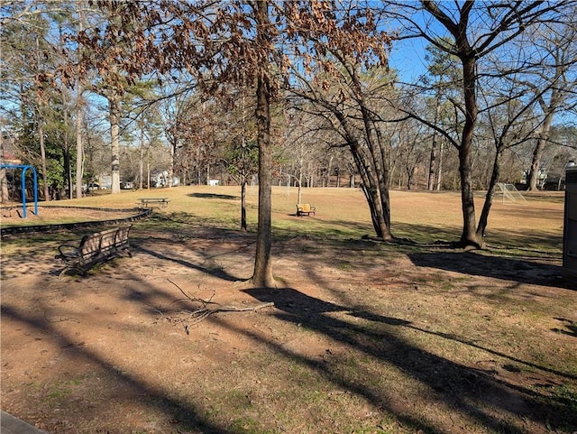 view of property's community with a yard