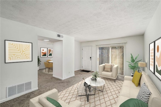 carpeted living area with baseboards and a textured ceiling