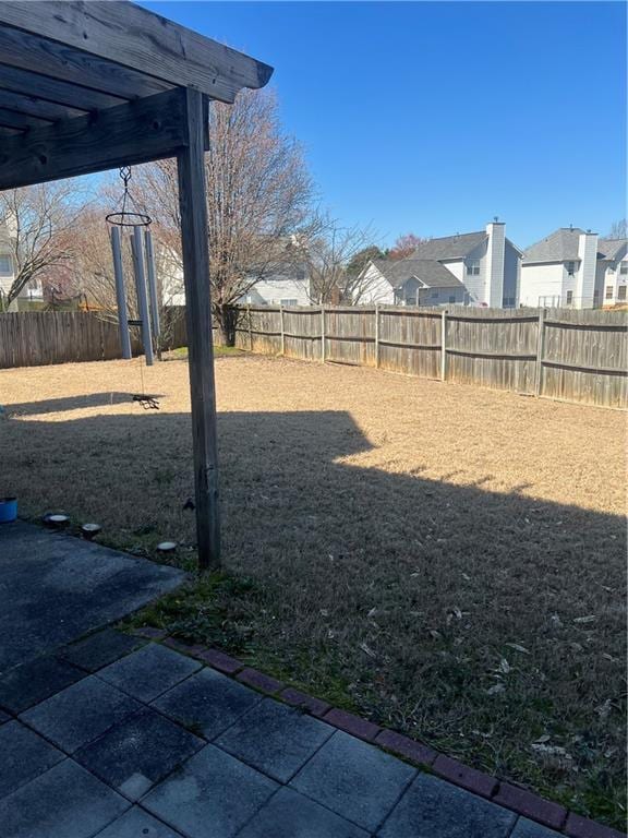 view of yard with a patio area and a fenced backyard