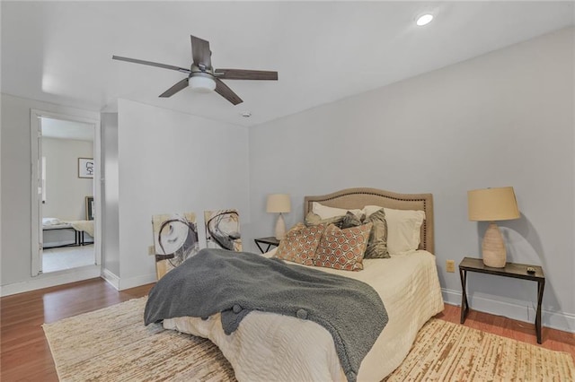 bedroom with ceiling fan, recessed lighting, wood finished floors, and baseboards