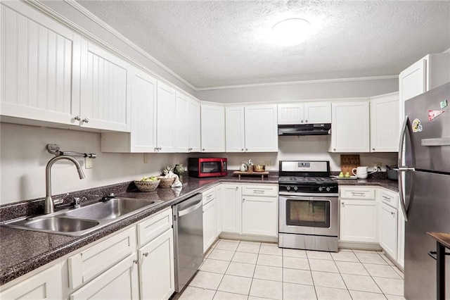 kitchen featuring light tile patterned floors, stainless steel appliances, white cabinetry, a sink, and under cabinet range hood