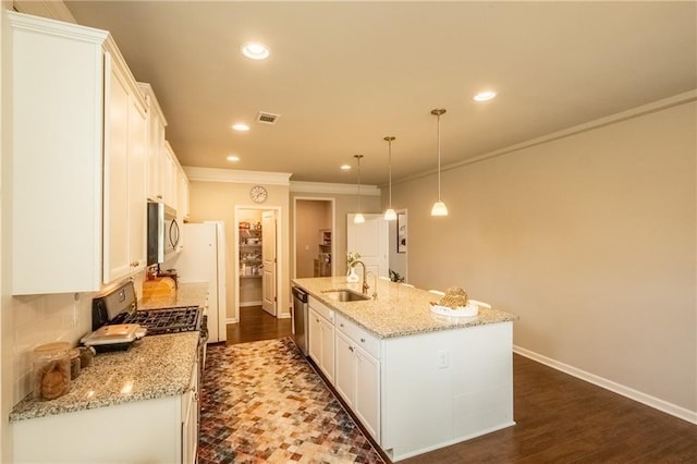 kitchen featuring white cabinetry, hanging light fixtures, stainless steel appliances, and a center island with sink