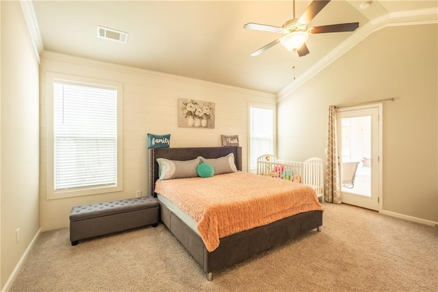 carpeted bedroom with ceiling fan, ornamental molding, and vaulted ceiling