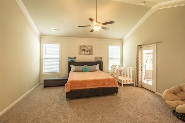 bedroom featuring crown molding, lofted ceiling, carpet flooring, and multiple windows