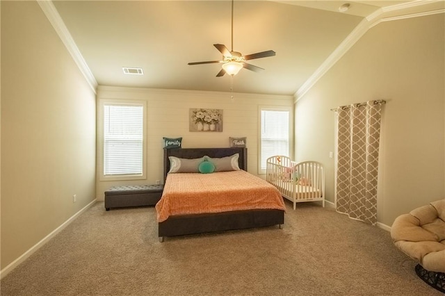 carpeted bedroom with ceiling fan, ornamental molding, and vaulted ceiling