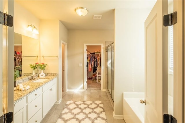 bathroom featuring vanity and plus walk in shower