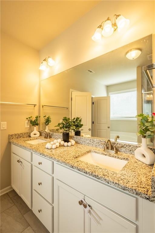 bathroom featuring vanity and tile patterned floors