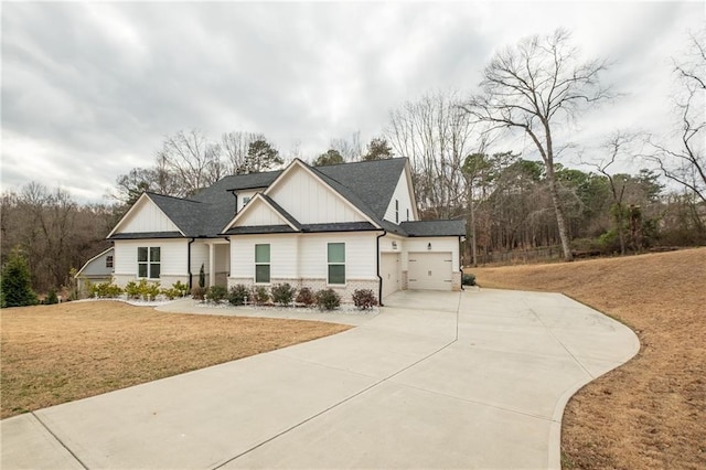 view of front facade with a garage and a front lawn