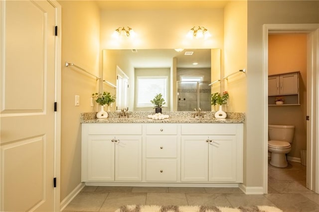 bathroom with vanity, an enclosed shower, tile patterned floors, and toilet