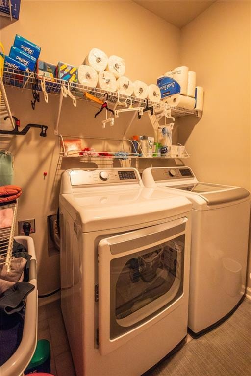 clothes washing area featuring washing machine and clothes dryer