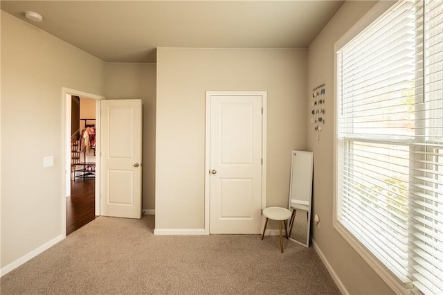 bedroom with light colored carpet