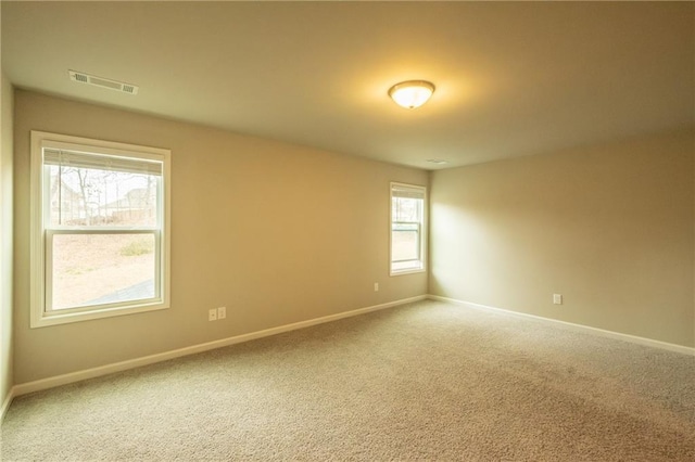 unfurnished room with carpet floors