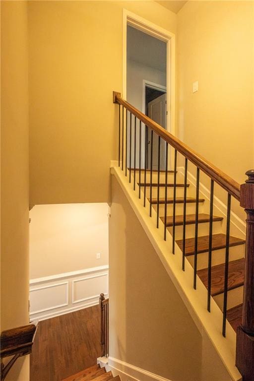 stairs with hardwood / wood-style floors