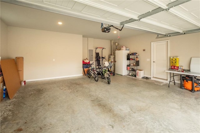 garage featuring fridge, a garage door opener, electric panel, and water heater