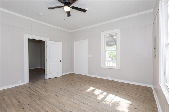 unfurnished room featuring ornamental molding, ceiling fan, and light hardwood / wood-style floors