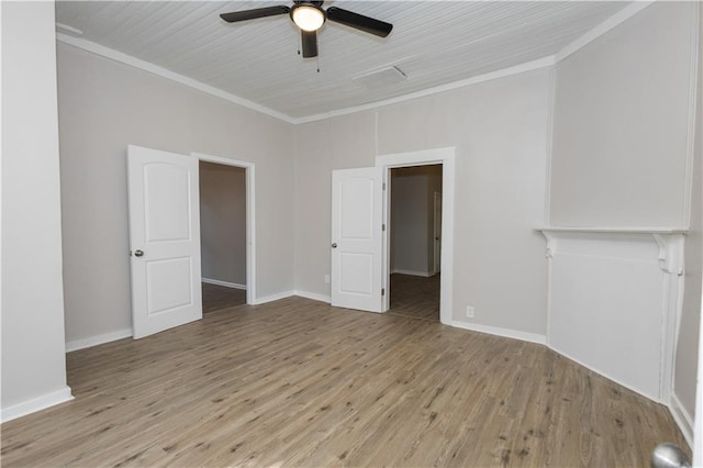 empty room featuring crown molding, ceiling fan, and light hardwood / wood-style floors