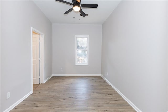 spare room with ceiling fan and light hardwood / wood-style floors