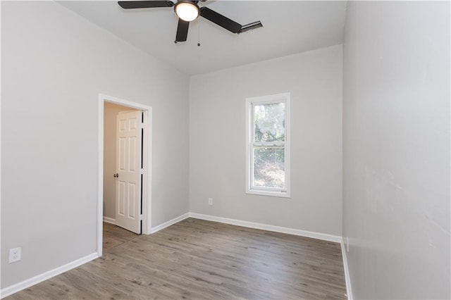 unfurnished room featuring ceiling fan and light wood-type flooring