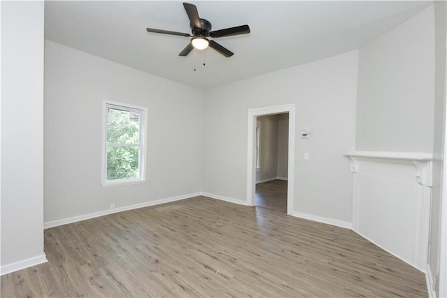 unfurnished room featuring light hardwood / wood-style flooring and ceiling fan