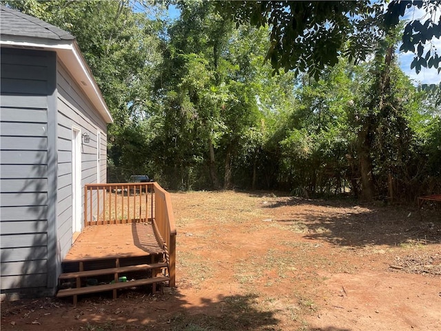 view of yard featuring a wooden deck