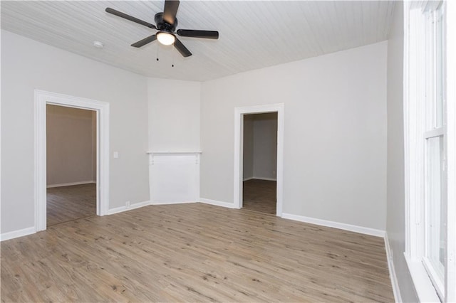 empty room featuring ceiling fan and light hardwood / wood-style floors